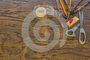 School and office supplys on table with wood