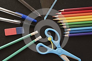 School and Office Utensils on a Dark Surface