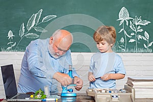 School. Old bearded teacher in the classroom. My Microbiology experiment. Funny teacher in the classroom. Kid from