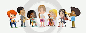 School Orchestra Kids Play Various Music Instrument photo