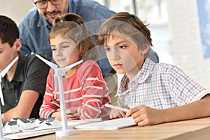 School pupils in class learning about natural energy resources