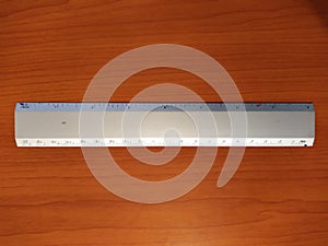 School ruler on wooden background