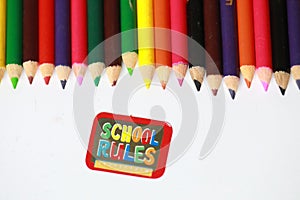 School rules character ,School supplies colored pencils in a row, isolated