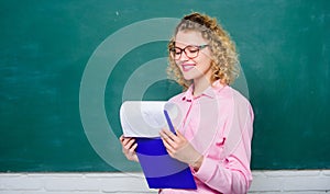 School staff. Smart woman hold tablet documents. Read impressing resume. School principal hiring workers. School teacher photo