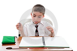 School student examining his work