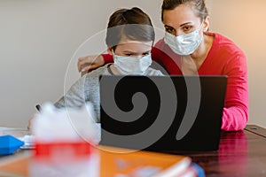 School student learning in video chat with teacher in e-learning