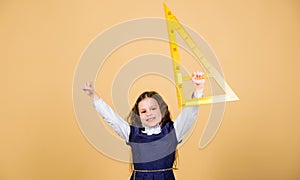 School student study geometry. Kid school uniform hold ruler. School education concept. Learn mathematics. Theorems and photo