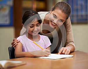 School, study or learning with a student and teacher in a classroom together for writing or child development. Education