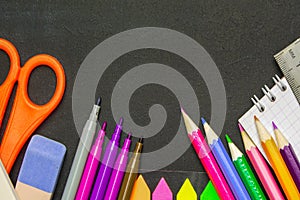 School supplies on blackboard background . The concept of education, study, learning, elearning. Back to school