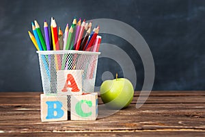 School supplies on blackboard background. The concept of education, study, learning, elearning. Back to school concept