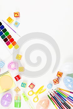 School supplies, child creativity concept flat lay. Various artistic tools for children on white desktop. Copy space