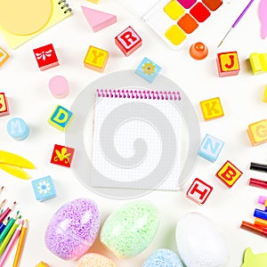 School supplies, child creativity concept flat lay. Various artistic tools for children on white desktop. Copy space