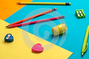 School supplies on a colored background