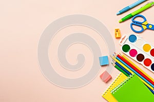 School supplies on colored background.