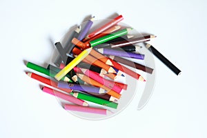 School supplies colored pencils in Fall scattered, isolated