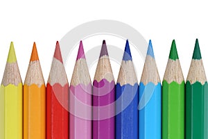 School supplies colored pencils in a row, isolated