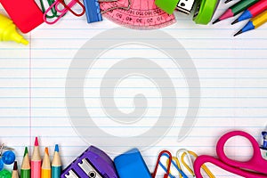 School supplies double border on lined paper background photo