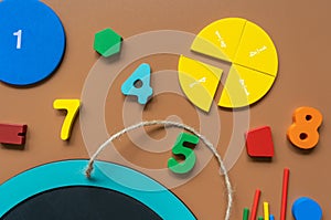 School supplies, math fractions, pencils, numbers on yellow background. Back to school, education concept background.