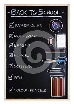 School supplies over blackboard background