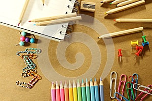 School supplies on paper brown background ready for your design