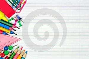 School supplies side border on lined paper background