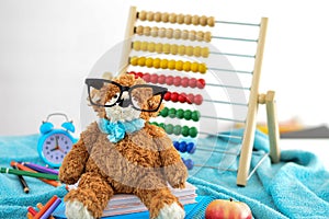 School supplies. Teddy bear with glasses