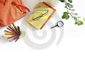 School supplies top view. Desktop white color with educational tools. Studens`s accessories flat lay empty copy space. Pancils,