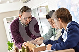 School teacher with pupils in science class