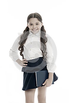 School textbook and stationery concept. Child school uniform smart kid happy hold textbook. Girl happy face carry