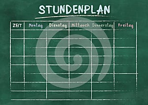 School timetable or class schedule on green chalkboard