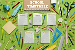 School timetable with stationery on green background. Lesson schedule