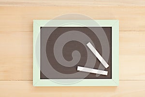 School wooden blank blackboard and white chalks