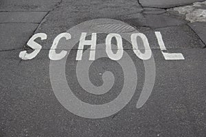 School zone sign on pavement