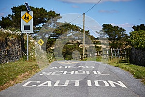 School zone warning sign on traffic