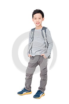 Schoolboy with backpack over white background