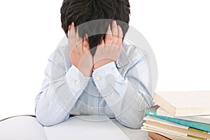 Schoolboy being stressed by his homework