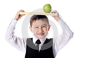 Schoolboy with book and apple