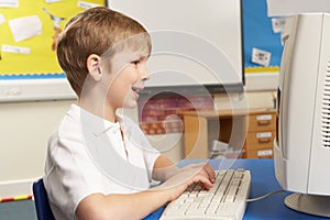 Schoolboy In IT Class Using Computer