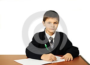 The schoolboy does a homework