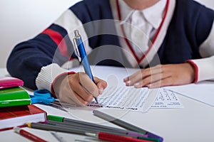 Schoolboy doing wordsearch photo