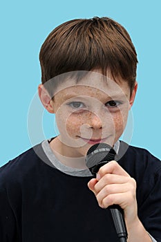 Schoolboy giving a performance and entertains the people photo