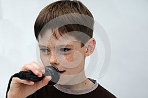 Schoolboy giving a performance and entertains the people