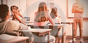 Schoolboy giving presentation in classroom