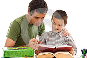 Schoolboy and his father learning