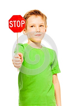 Schoolboy holding small red Stop sign icon