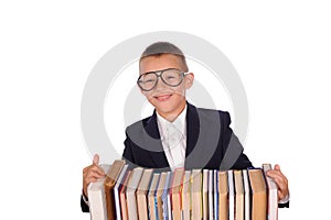 Schoolboy with huge stack of books