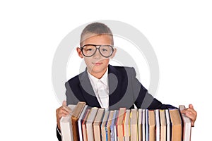 Schoolboy with huge stack of books