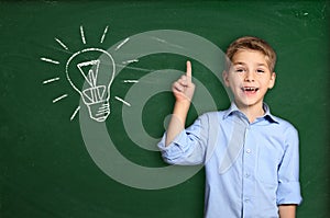 Schoolboy with light bulb