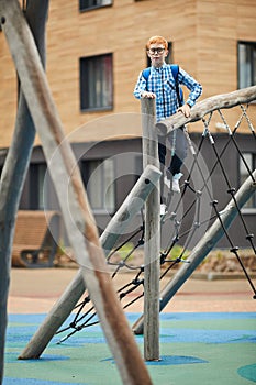 Schoolboy playing on the schoolyard