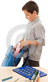 Schoolboy prepare the schoolbag photo